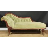 A Victorian mahogany scroll end chaise longue, carved with scrolling acanthus, turned legs,