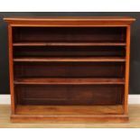 A late Victorian walnut open bookcase, rectangular top above three adjustable shelves, skirted base,