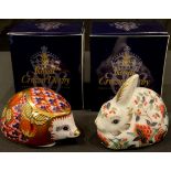A Royal Crown Derby paperweight, Orchard Hedgehog, gold stopper, boxed; another Meadow Rabbit,