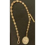 A Victorian 9ct gold graduated fancy link Albert chain, brass T-bar, gold plated locket, marked 9ct,