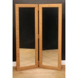 A 'gilt' framed bifold screen, each panel set with a mirror plate, 156cm high, each panel 56.5cm