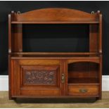 A Victorian Aesthetic Movement walnut salon wall cabinet, arched cresting above an open shelf, a