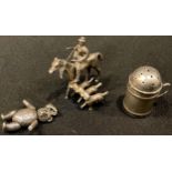 A silver miniature model, cast as a huntsman and hounds; an articulated teddy bear pendant; a