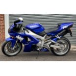 A 1998 Yamaha YZF-R1 998CC motorcycle, in blue, registration S811LMO (private registration