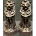 A pair of painted composition lion models, 33.5cm high (2)