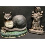 A cast iron door stop, as a seated black cat; another, Sairy Gamp (2)