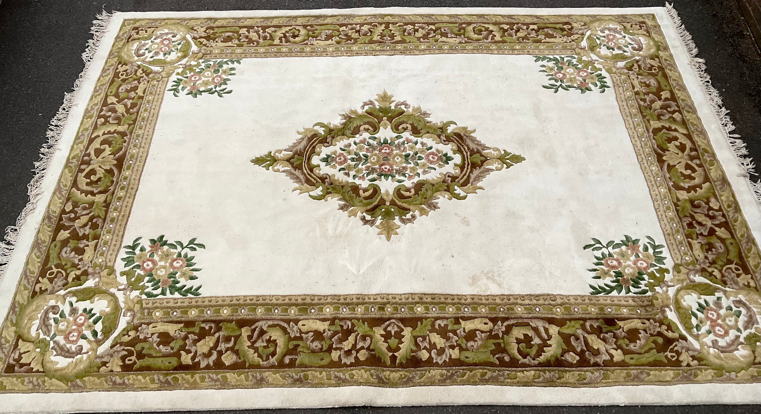 A Chinese rectangular woollen carpet, 369cm x 275cm