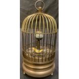 A reproduction novelty automaton clock, as a bird in a cage, 15cm high