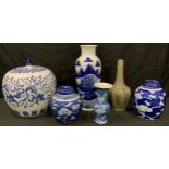 A Chinese ovoid blue and white jar and cover; a Chinese blue and white vase; two prunus pattern