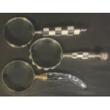 A collection of three magnifying glasses, various decorative handles, the longest 26.5cm