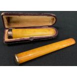 An 18ct gold mounted cheroot holder; another 9ct gold mounted, cased (2)