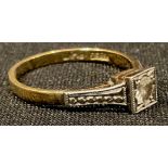 An early 20th century 18ct gold diamond solitaire ring, size L, platinum bezel with illusion cut