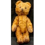 Toys & Juvenalia - a mid 20th century golden plush mohair teddy bear, glass eyes, rexine type pads