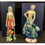 An Old Tupton Ware tube lined figure, girl in a floral dress, TW4183, 30cm, boxed; another, with