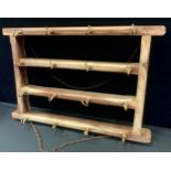 A pine and brass suspension kitchen hanger, with sixteen brass pan hooks, 60cm long, 40cm wide