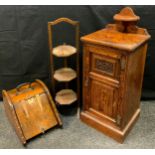 An early 20th century pitch-pine side cupboard, the quarter galleried top with semi-circular