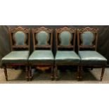 A set of four late Victorian carved dining chairs, green leather backs and seats, turned legs, c.