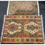 A hand-knotted Turkish Kilim rug, 172cm x 131cm; another middle eastern carpet, (2)