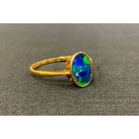 A Black Opal panel ring, vibrant blue and green colour play, 18ct gold shank, 2.4g gross.