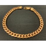 A Gentleman's 9ct gold curb link bracelet, 21cm long, 22.8g