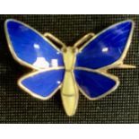 A Norwegian Einar Modahl silver gilt enamel butterfly brooch, tones of blue and yellow, stamped