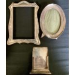 A silver photograph frame, oval, 14cm high' another, rectangular; etc