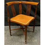 An Edwardian mahogany bow-back corner chair, boxwood stringing throughout, turned legs, x-frame