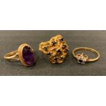 A 9ct gold garnet rope twist cluster ring; another CZ 9ct gold shank; amethyst oval ring, 9ct gold