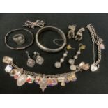 A silver Padlock bracelet; silver charm bracelet; silver hinged bangle; another; silver ring; etc