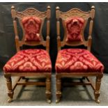 A pair of Edwardian carved oak side chairs, shaped carved rail, turned reeded columns, shaped