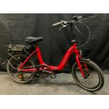 A Wisper 806 electric folding bicycle, red