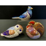 A Royal Crown Derby paperweight Blue Jay; others Owl. Cockerel all gold stoppers (3)
