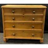 A Victorian pine chest of two short over three long drawers, turned feet, 106cm high, 116cm wide,