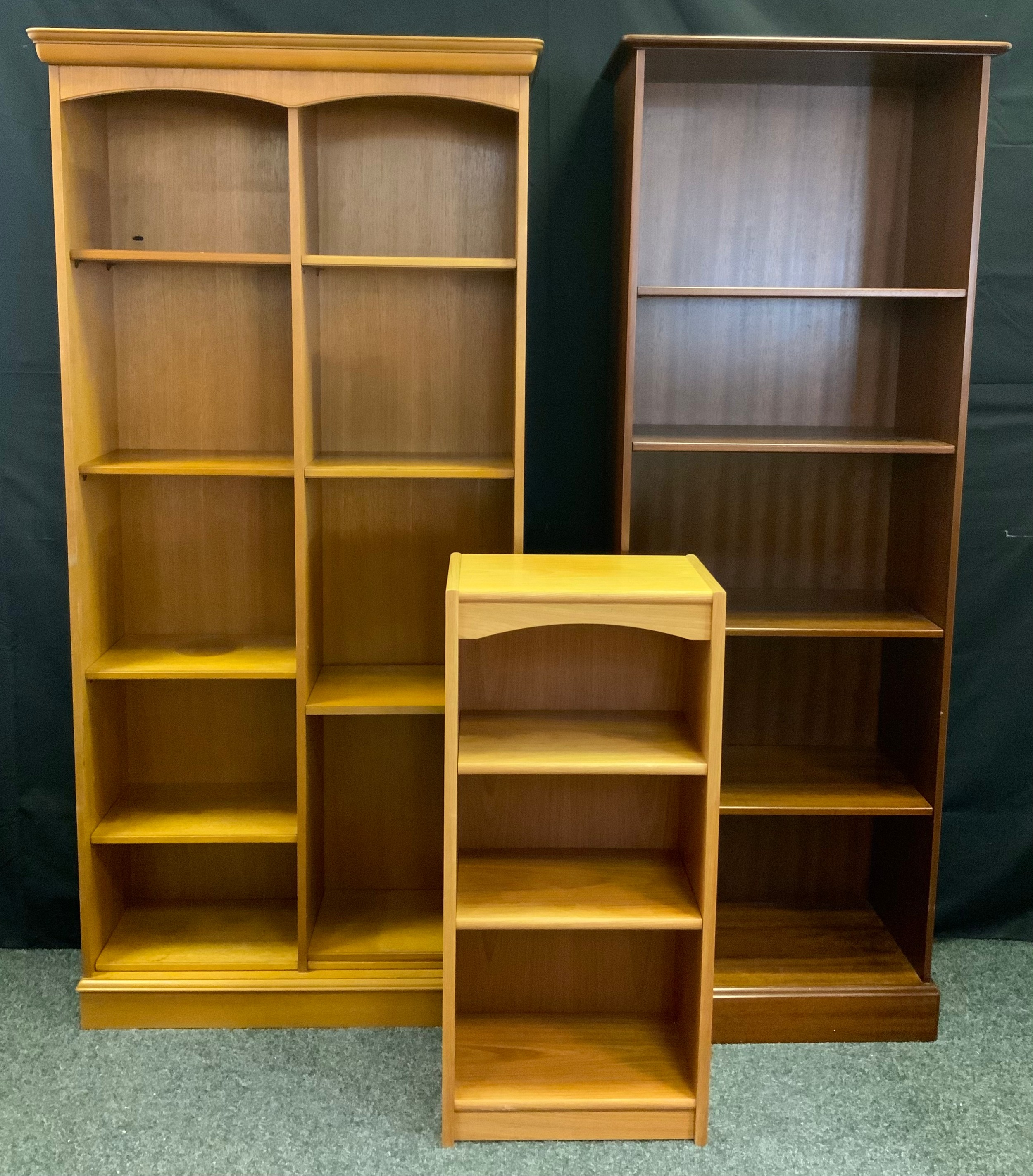 A Stag teak shelving unit, 183cm tall x 87cm wide; a tall mahogany bookcase, four tiers of shelving,