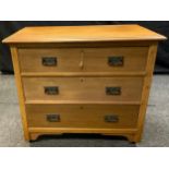 A light oak three drawer chest over sailing top, art nouveau handles, 82cm high, 91.5cm wide, 48.5cm