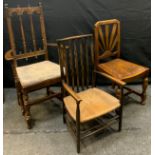 A 19th century oak rush seated chair, serpentine spalts, plain arms, turned fore legs, twin bar