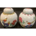 A near pair of Chinese Famille Rose ginger jars, character mark to base, each 15cm high