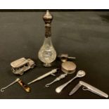 A 19th century silver mounted scent bottle; a silver pill box; silver novelties; button hooks; a