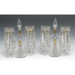 A pair of 19th century cut-glass two-branch mantel lustres, 'javelin' columns, shaped circular