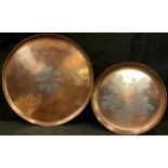 An Arts and Crafts style planished circular copper tray, by Paul Gilling, 37cm diameter,