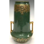 A Royal Worcester two handled vase, gilded flowers amongst scrolling foliage on mottled green