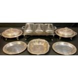 A pair of Victorian Mappin & Webb plated entree dishes on stands; other serving dishes; a table