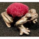 A silver novelty pin cushion, as a frog