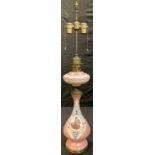 A 19th century Continental glass oil lamp, later converted to electricity, 89cm high