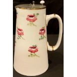 A William Moorcroft for James Macintyre tube lined jug, applied with pink rose buds, pewter hinged