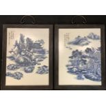 A pair of reproduction Chinese blue and white wall plaques, hardwood frames, 43cm x 28.5cm over