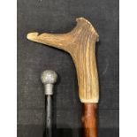 A George V silver mounted walking cane, London 1914; another walking stick, the antler handle with a