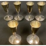 A set of six silver toasting cups, each bearing crest, Sheffield 1945, 208g