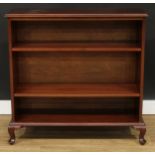 A mahogany open bookcase, rectangular top above a pair of adjustable shelves, cabriole legs, bears