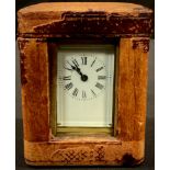A miniature lacquered brass carriage clock, white enamel dial, Roman numerals, dated 1902, 9cm